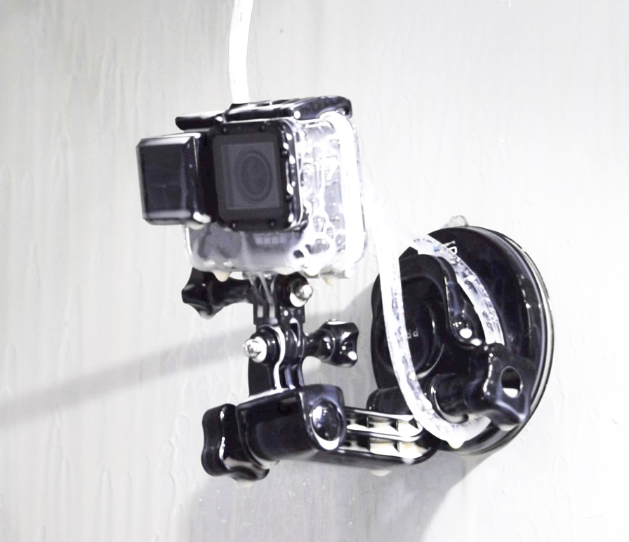 GoPro camera inside a CNC machine with air knife attached. The lens is clean.