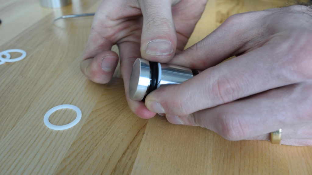 Assembling O-rings and backup rings into a piston-style seal gland.