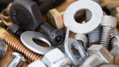 An assortment of fasteners like nuts bolts and washers